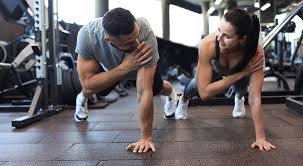 Toning Bingo Wings: Your Ultimate Guide to Sculpting Sleek Arms at the Gym 3 Fitness trainer demonstrating arm toning exercises Dorset