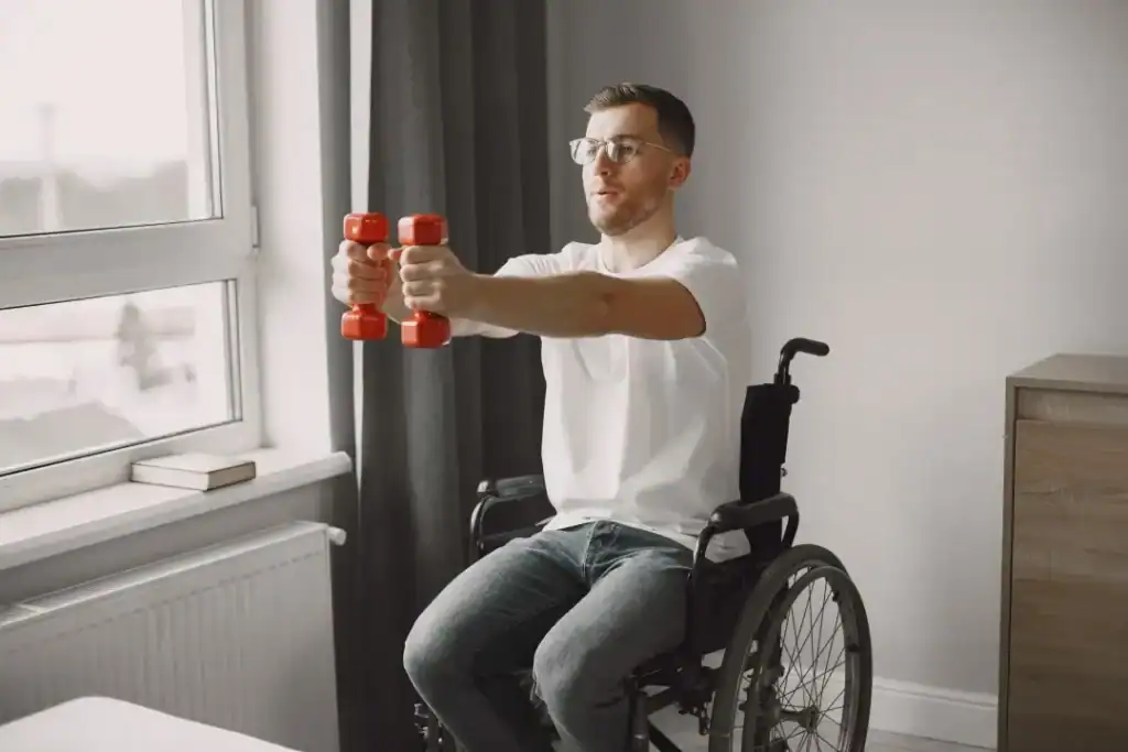 Image of man doing exercise in his wheelchair to aid weight loss Dorset